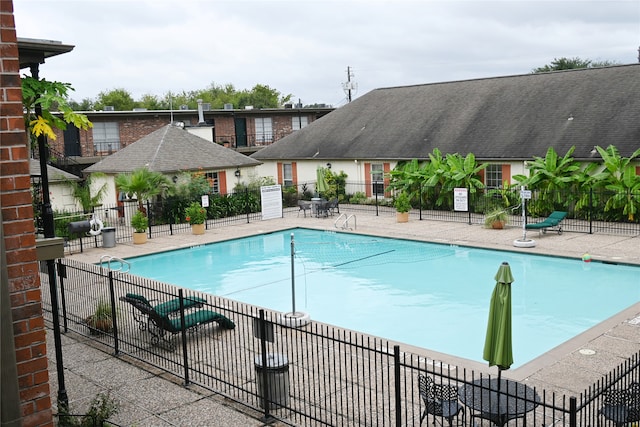 view of swimming pool featuring a patio area