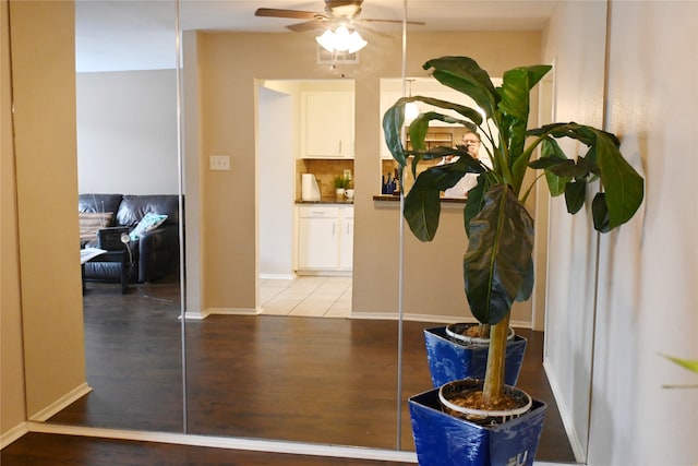 hallway with wood-type flooring