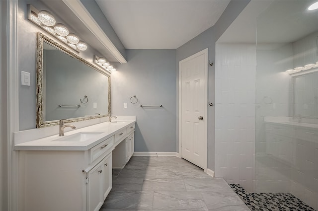 bathroom with a shower and vanity