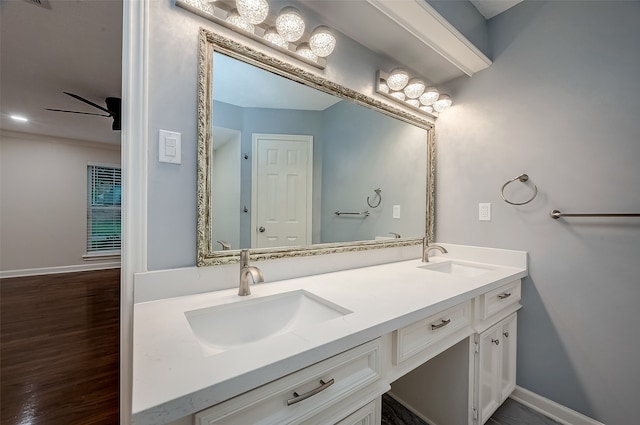 bathroom featuring vanity, wood-type flooring, and ceiling fan