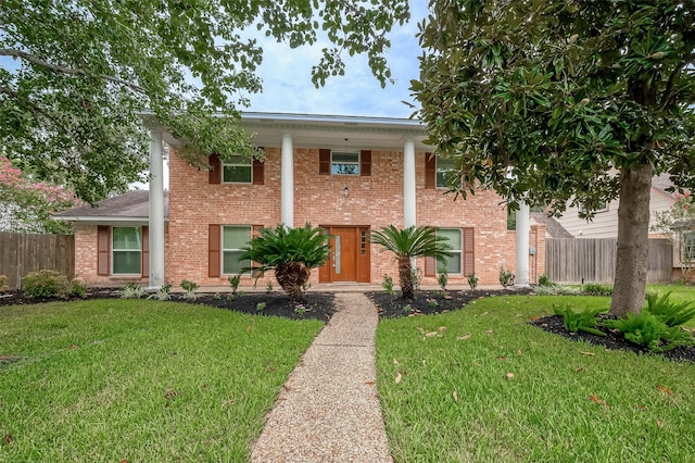 neoclassical home with a front yard