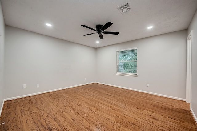 empty room featuring ceiling fan and light wood-type flooring