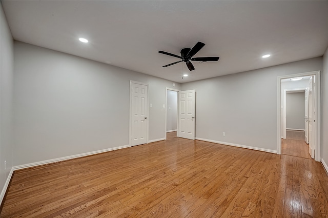 spare room featuring ceiling fan and light hardwood / wood-style floors