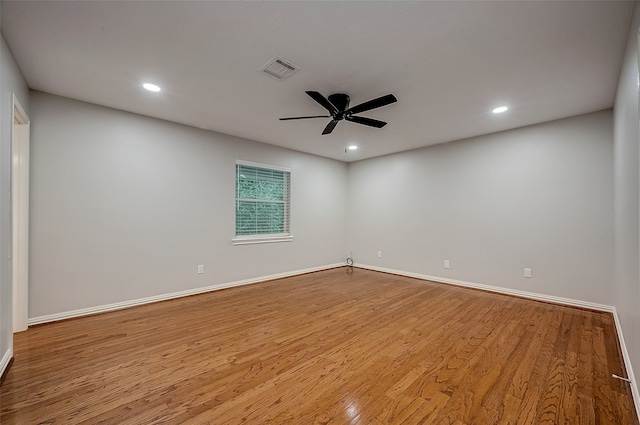 unfurnished room with ceiling fan and light hardwood / wood-style floors