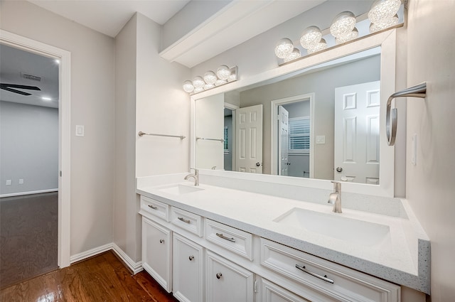 bathroom featuring vanity, wood-type flooring, and ceiling fan