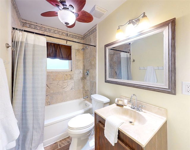 full bathroom with ceiling fan, vanity, toilet, and shower / tub combo with curtain