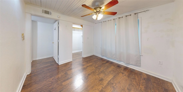 interior space featuring ceiling fan, dark wood-type flooring, and crown molding