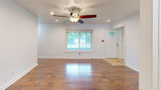 spare room featuring ceiling fan and dark hardwood / wood-style flooring