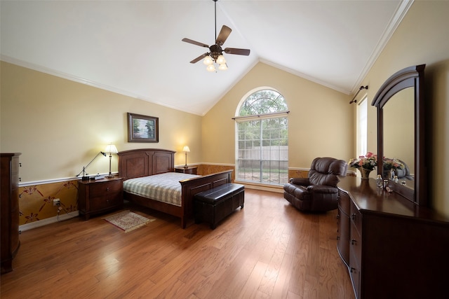 bedroom featuring wood-type flooring, ornamental molding, ceiling fan, and high vaulted ceiling