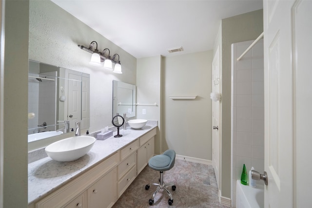 bathroom featuring tile patterned flooring and vanity