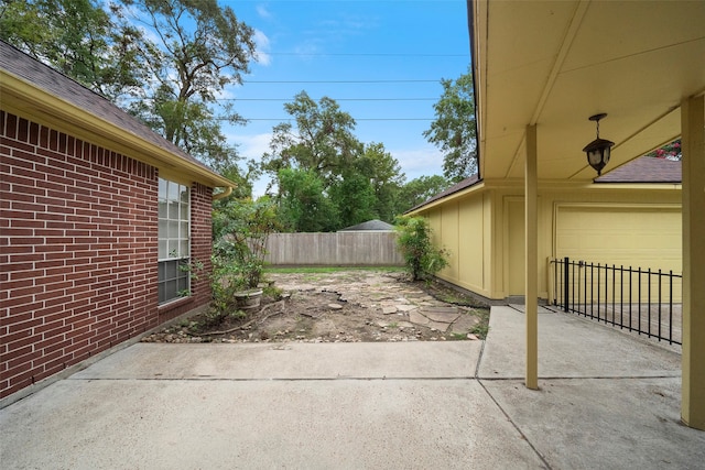 view of patio / terrace featuring a garage