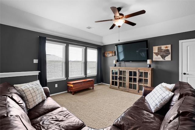 living room featuring carpet and ceiling fan