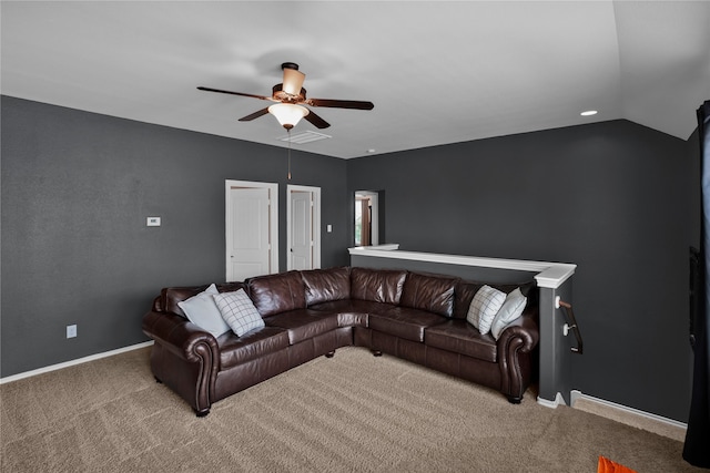 living room featuring carpet floors, vaulted ceiling, and ceiling fan