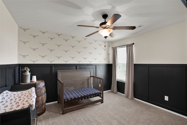 carpeted bedroom with ceiling fan