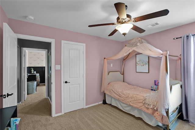 bedroom featuring light carpet and ceiling fan