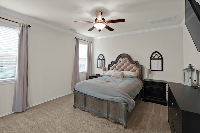 carpeted bedroom with crown molding and ceiling fan