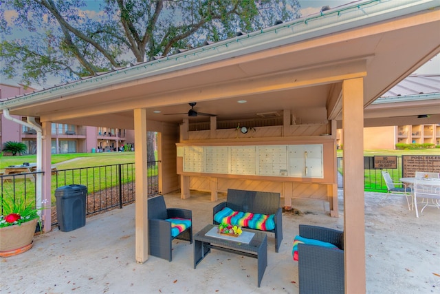 view of patio with an outdoor living space and a mail area