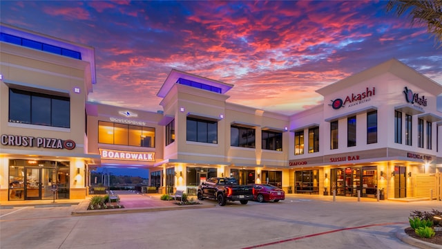 view of outdoor building at dusk