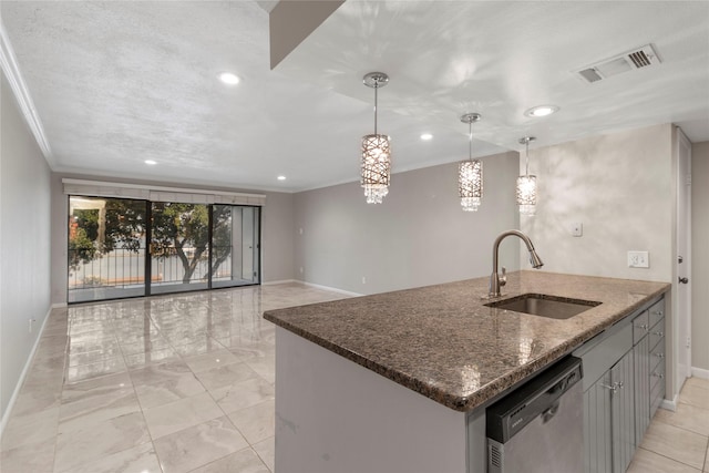 kitchen featuring stainless steel dishwasher, ornamental molding, dark stone counters, sink, and decorative light fixtures