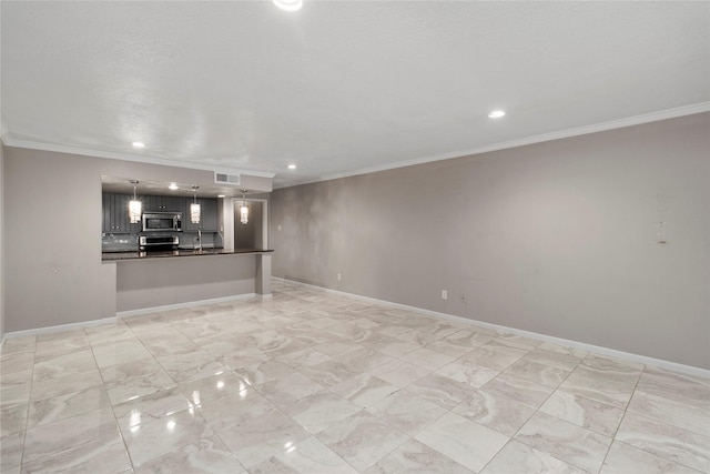 unfurnished living room featuring crown molding and sink