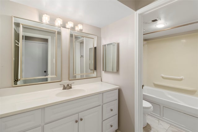 full bathroom featuring vanity,  shower combination, and toilet