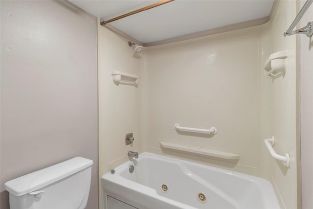 bathroom featuring shower / bathtub combination and toilet