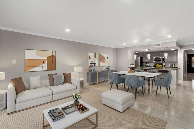 living room featuring light tile patterned floors and ornamental molding