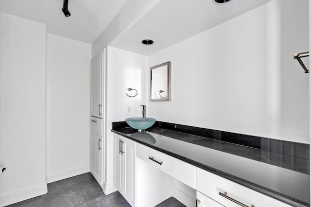 bathroom featuring tile patterned flooring and vanity