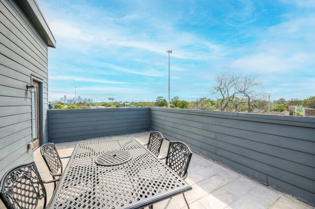 view of patio featuring a balcony