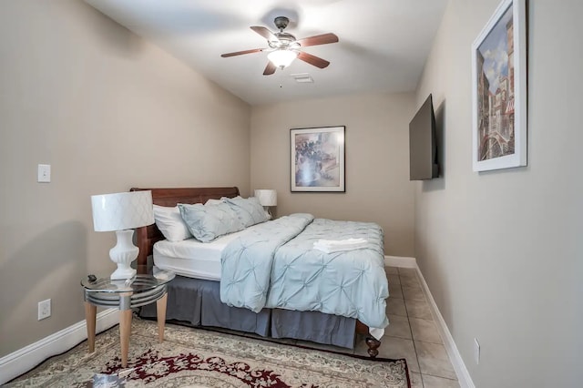 bedroom with light tile patterned flooring and ceiling fan