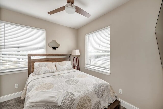 carpeted bedroom featuring ceiling fan