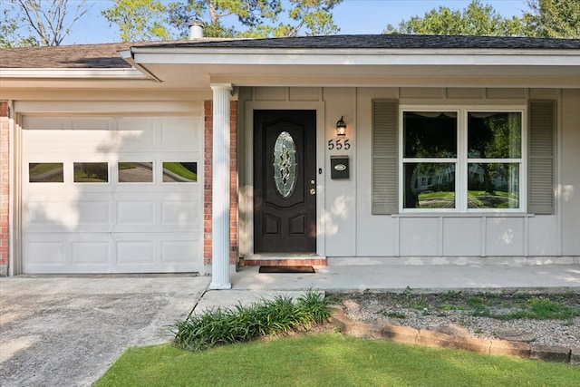 view of exterior entry featuring a garage