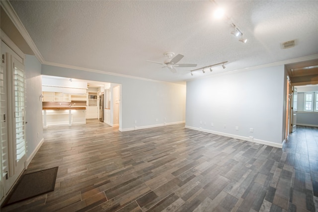 interior space featuring hardwood / wood-style floors, ceiling fan, ornamental molding, and a textured ceiling