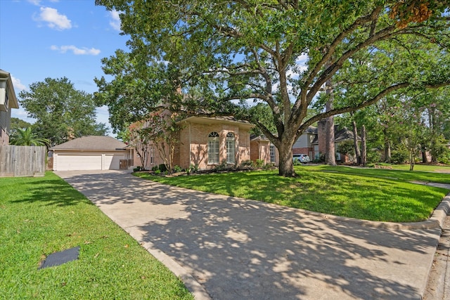 view of front of house with a garage and a front yard