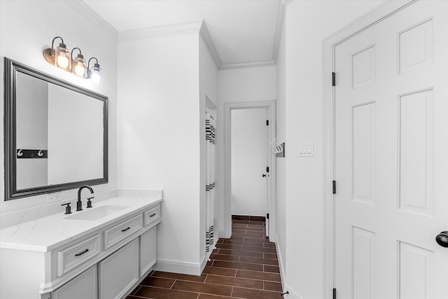 bathroom with ornamental molding and vanity