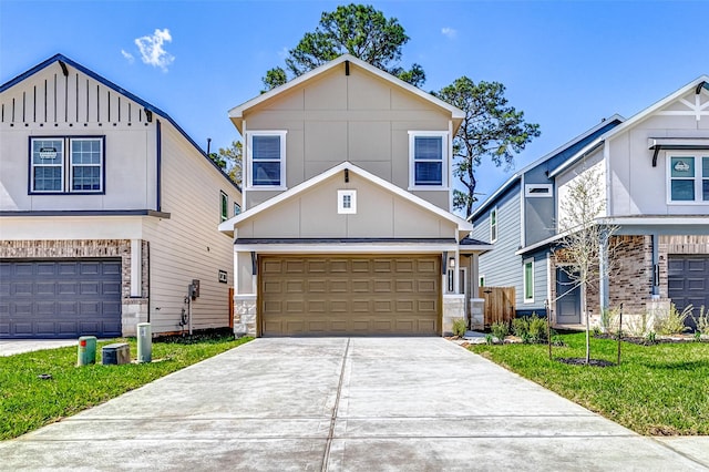 view of front of property with a garage, board and batten siding, concrete driveway, and a front lawn