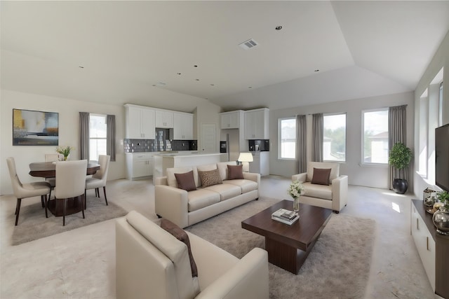 living room featuring vaulted ceiling