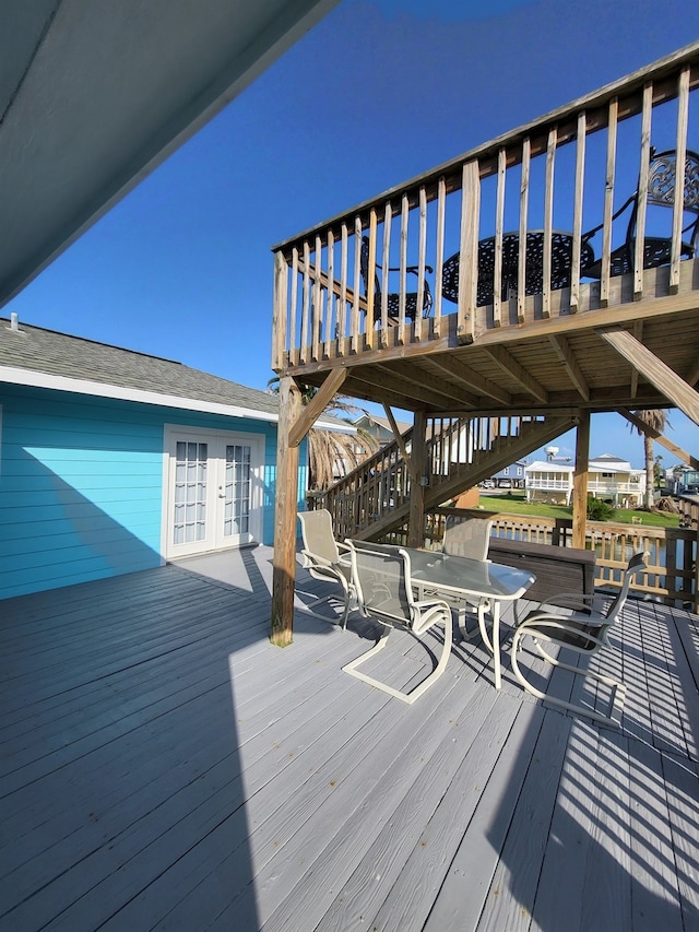 wooden deck featuring french doors