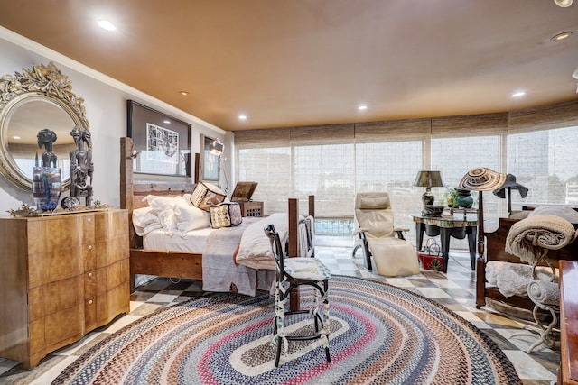 bedroom with ornamental molding and multiple windows