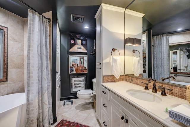 full bathroom featuring vanity, separate shower and tub, toilet, and tile patterned floors