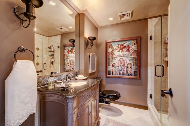 bathroom with vanity, walk in shower, toilet, and tile patterned flooring