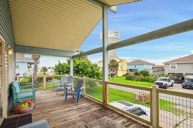 deck featuring a lawn