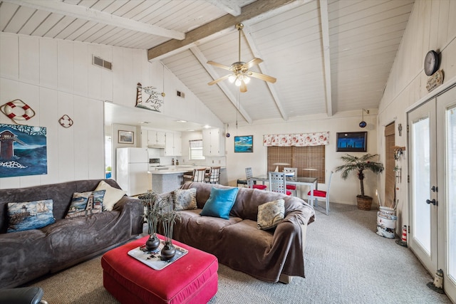 living room featuring beamed ceiling, high vaulted ceiling, ceiling fan, carpet, and french doors