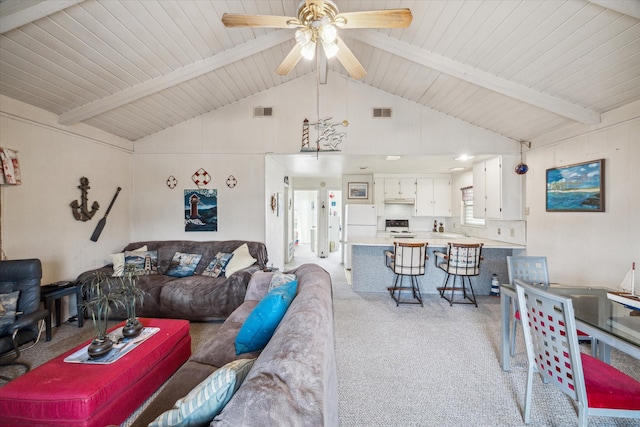 living room featuring light carpet, ceiling fan, wood ceiling, and lofted ceiling with beams