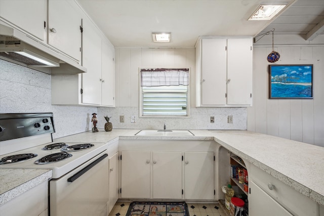 kitchen featuring wooden walls, tile patterned flooring, white cabinetry, white range with electric cooktop, and sink