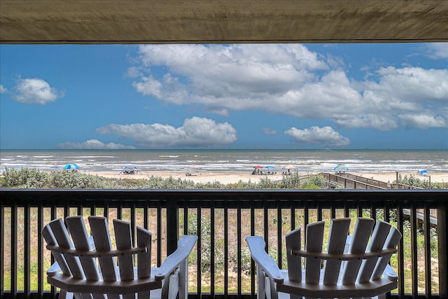 exterior space featuring a beach view and a water view