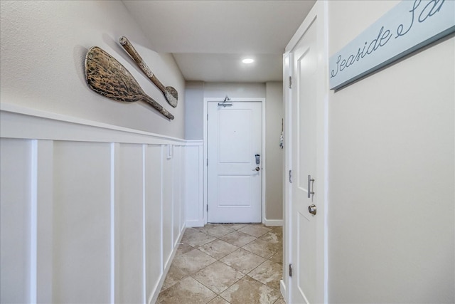 corridor with light tile patterned floors