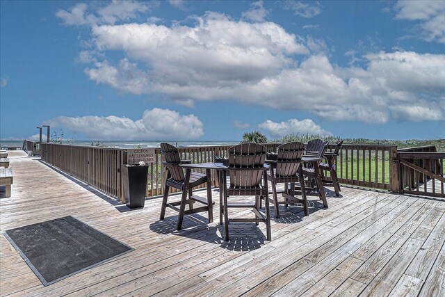 wooden terrace with a water view