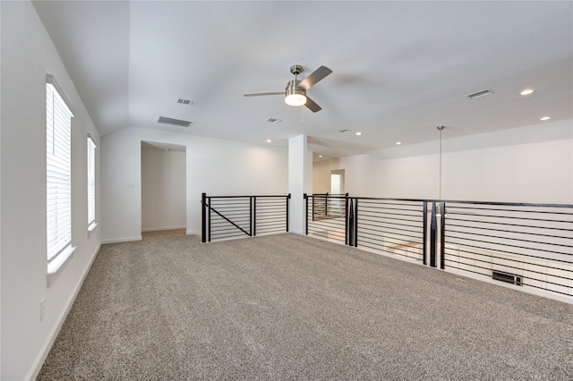 empty room with ceiling fan and carpet