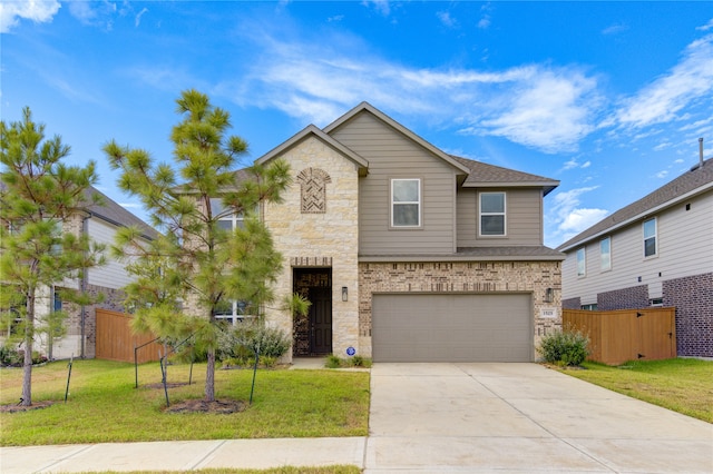 view of front of home with a garage and a front lawn